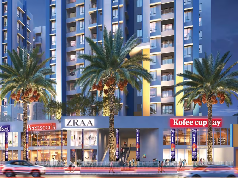 Commercial plaza at the project entrance at dusk