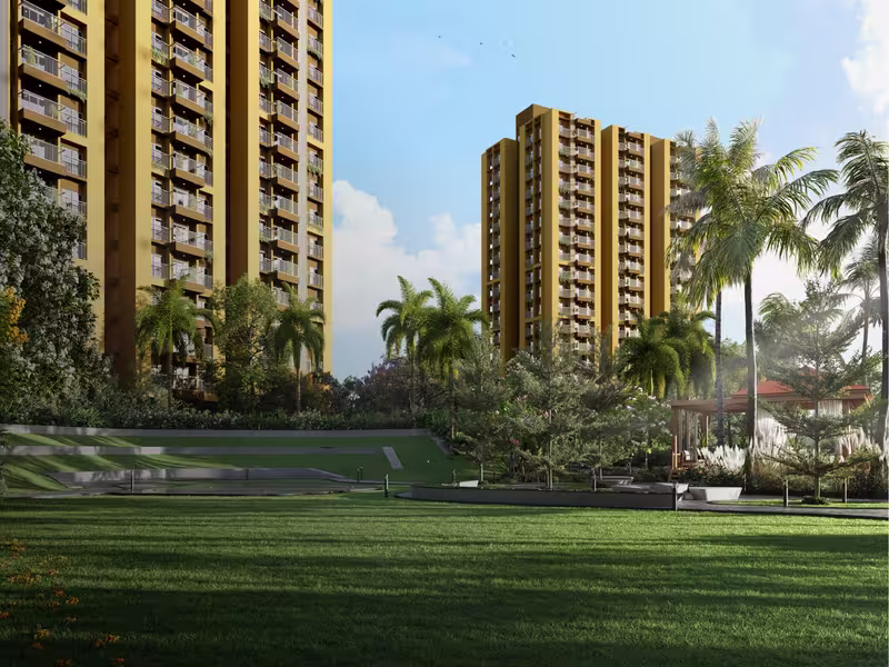Central lawn framed by palms with the towers behind