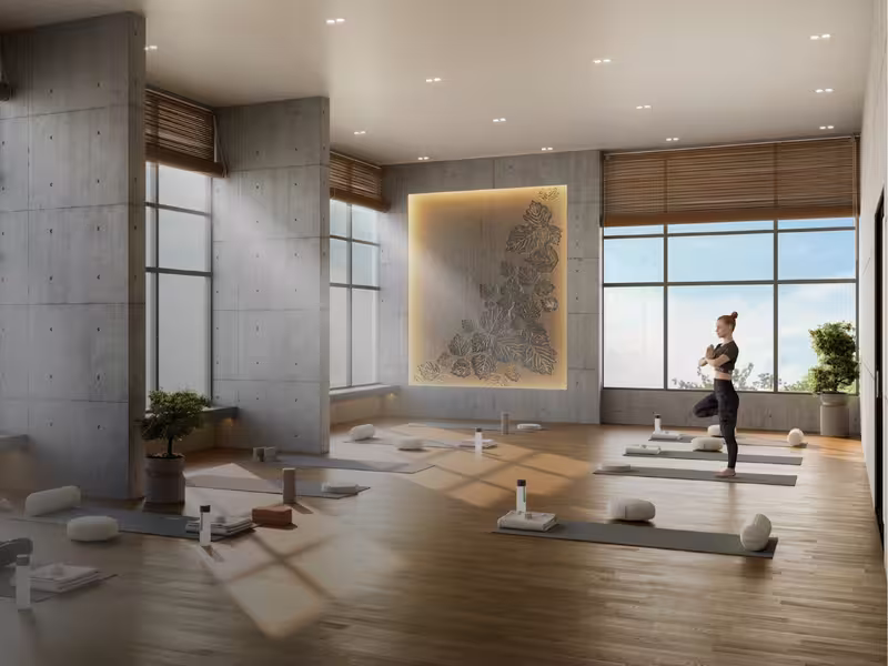 Yoga room with timber flooring and garden views